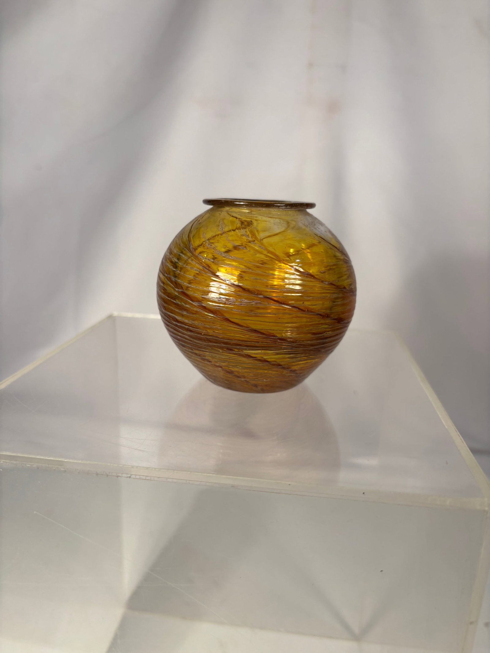 Finnish Art amber Glass Perfume Bottle, Signed and Dated 1986: Hand-blown art glass perfume bottle in amber tones with spiral ribbed decoration. Signed indistinctly and dated 1986 to the polished underside. Probably Scandinavian, likely Finnish.Height: 3.25 inche