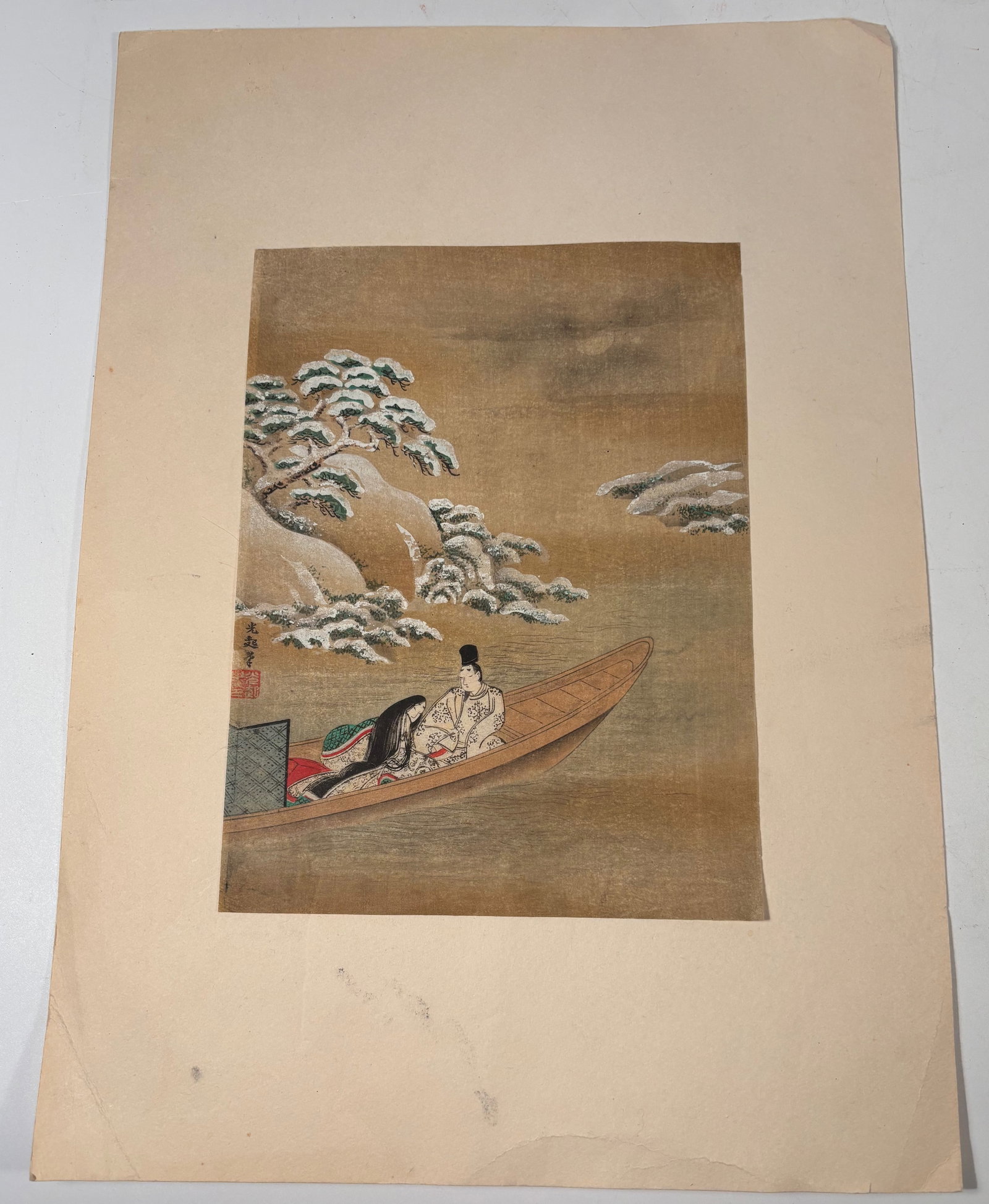 A Japanese Court Scene Woodblock , Marked Tosa Mitsuoki: Japanese print depicting a courtly scene in a boat, likely inspired by The Tale of Genji. The work bears the mark “Mitsuoki” in reference to the Tosa school master. Gold ground background. Paper s