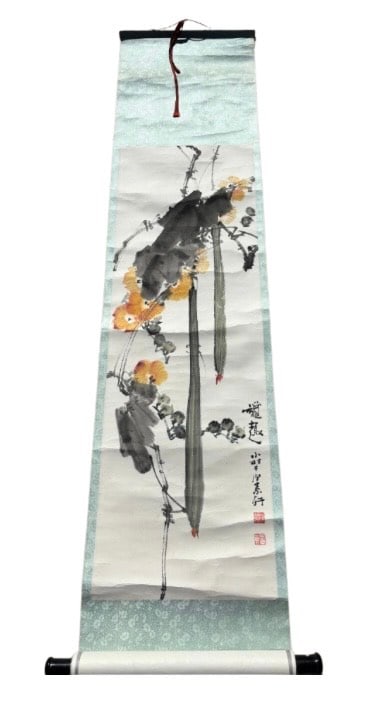 A Chinese Watercolor Scroll – Bamboo and Blossoms, Signed Xiaocun: 20th century; A Chinese ink and watercolor hanging scroll painting featuring a striking depiction of bamboo stalks and yellow-orange blossoms, executed in a bold freehand brush style. The composition 