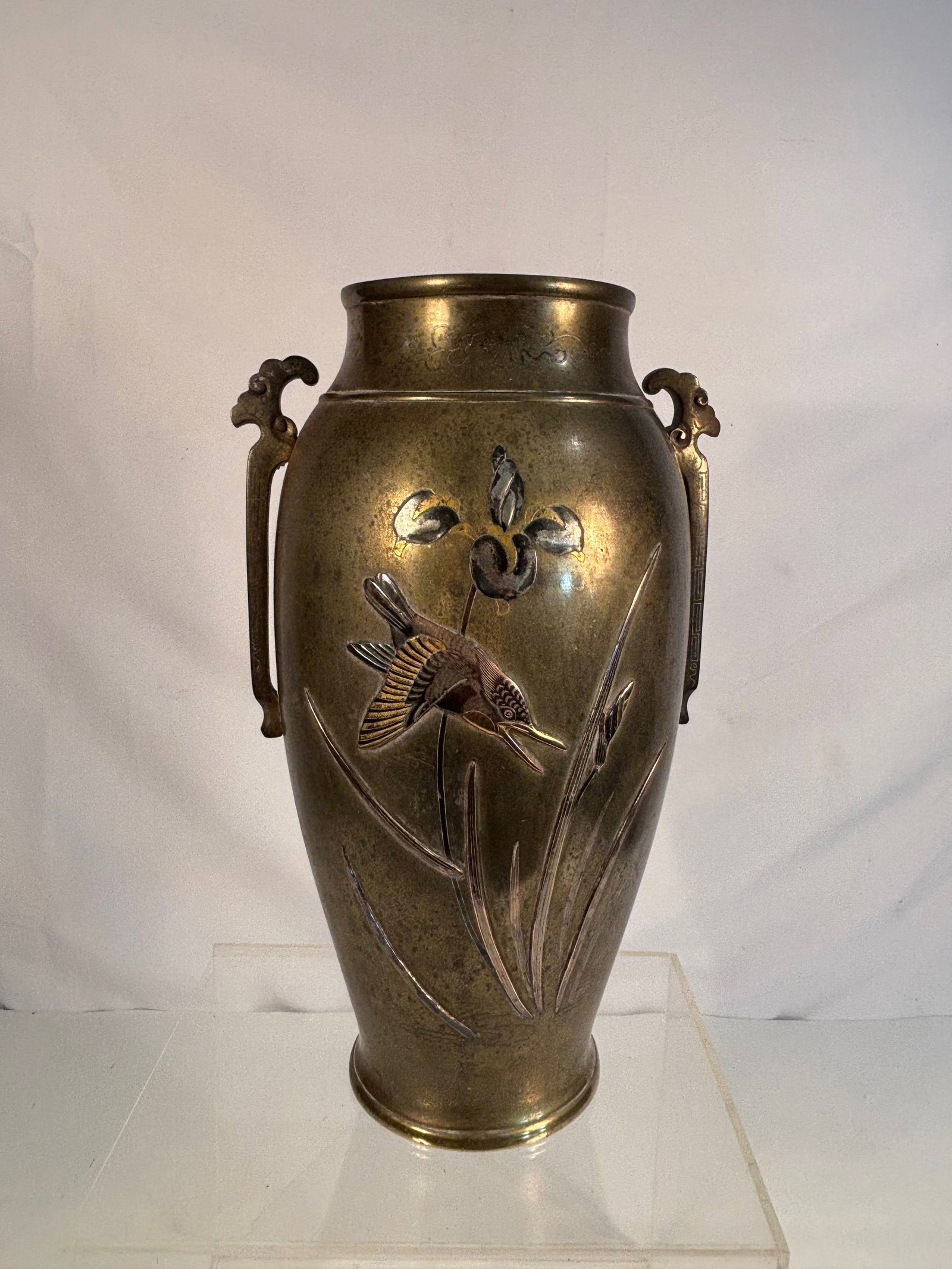 A Japanese Mixed-Metal Bronze Vase with Birds and Flowers , Meiji Period: A Japanese Meiji period (1868–1912) bronze vase, finely decorated in mixed metals with inlaid birds, flowers, and foliage in silver, gilt, and shakud?. The baluster form features twin stylized drago