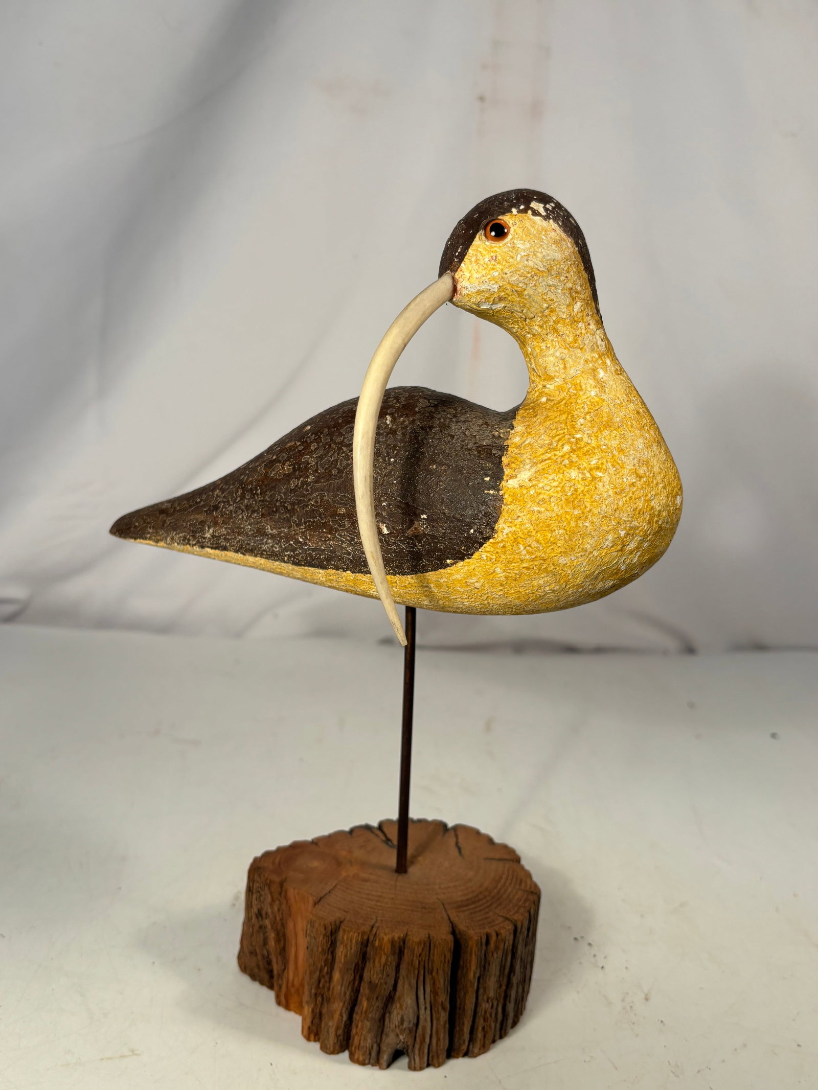 Richard Morgan for The Painted Bird Hand-Carved Hudsonian Curlew Shorebird Decoy: A hand-carved and hand-painted Hudsonian curlew shorebird decoy by Connecticut folk artist Richard Morgan for The Painted Bird. Modeled after early American hunting decoys, the bird features a distinc