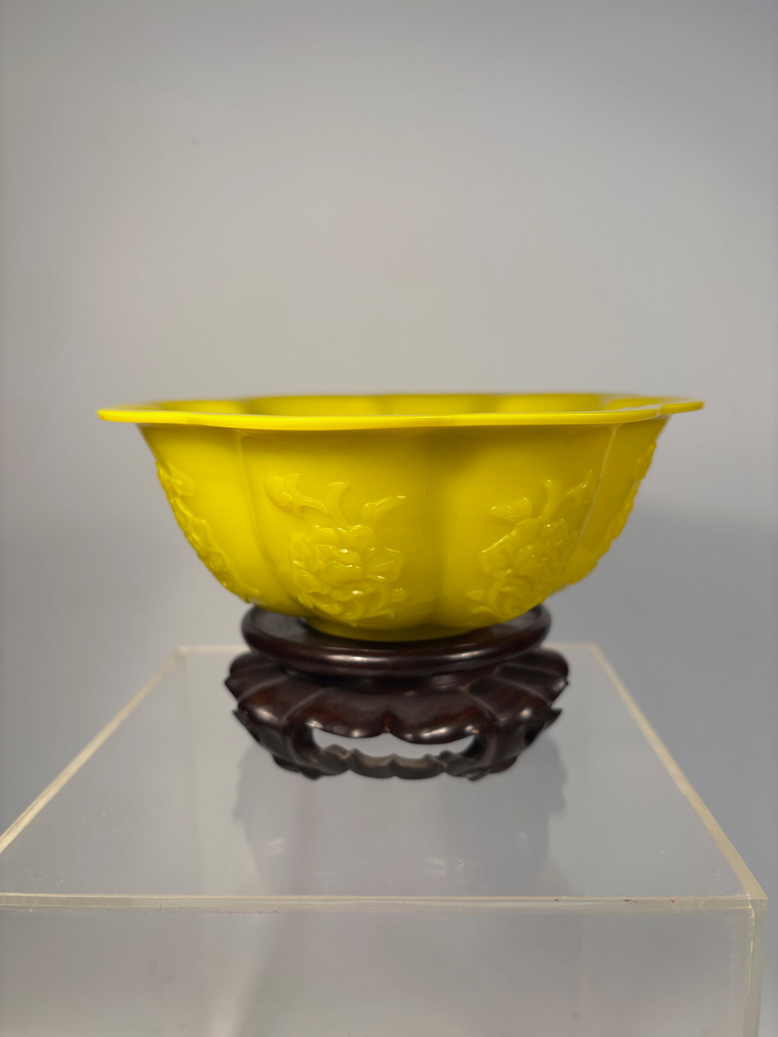 A Chinese Peking Glass Lobed Bowl – Imperial Yellow Molded Floral Design: Qing Dynasty(1644-1912); A beautifully molded Chinese Peking glass bowl in the form of a lobed melon, rendered in a brilliant imperial yellow hue. The body features finely detailed relief-molded flora