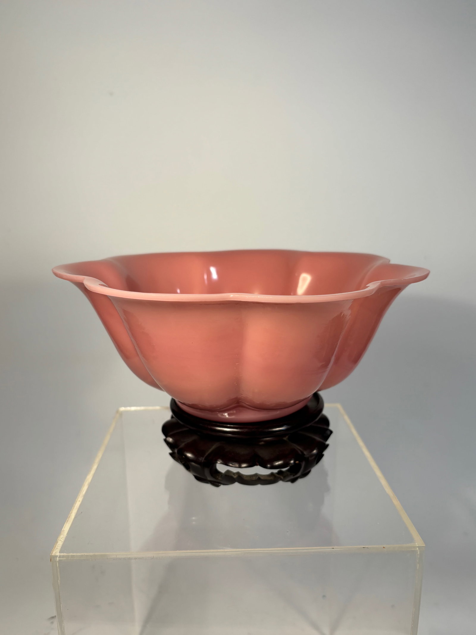 A large Chinese Pink Peking Glass Lotus Bowl carved "MADE IN CHINA": Qing Dynasty(1644-1912); A beautiful Chinese Peking glass bowl molded in a soft lotus flower form, with lobed petals radiating from a recessed foot to a delicately flared rim. Crafted in a luminous tr