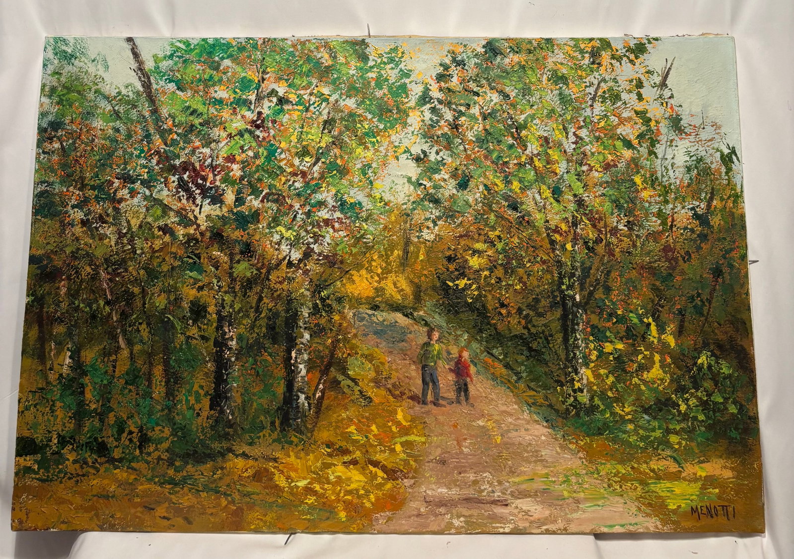 Menotti Signed Autumn Woodland Landscape Oil Painting: Original oil painting on canvas depicting a wooded autumn pathway with two figures walking beneath colorful foliage. Executed in a bold palette knife technique with rich texture and vibrant seasonal c