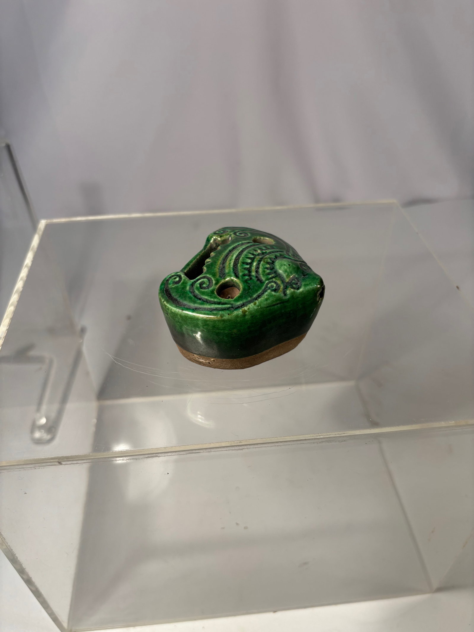 A Chinese Spinach-Green Glazed Pottery Water Dropper: Probably Liao Dynasty, 10th–12th Century; Molded in a heart-shaped form, this pottery water dropper is finished in a deep spinach-green glaze characteristic of ceramic wares attributed to the Liao d