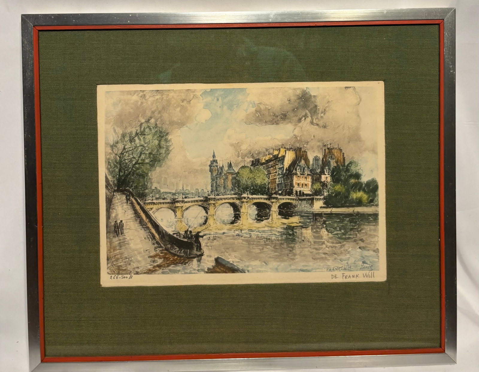 Frank Will (French, 20th Century) Paris Seine River View Color Lithograph, 266/500: Limited edition color lithograph after Frank Will, depicting a picturesque Paris riverside scene with a historic stone bridge, moored boats, and classic French architecture. Executed in an Impressioni