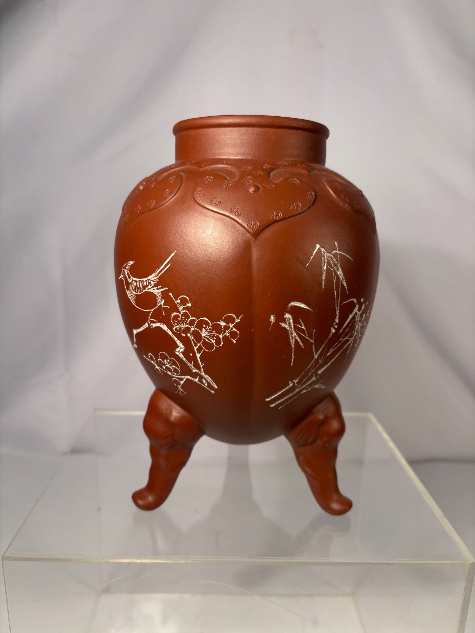 A Chinese Yixing Zisha Clay Tripod Incense Burner, Bird & Cloud Motifs: Chinese Yixing (zisha) clay tripod incense burner, modeled in an archaistic form with rounded body raised on three tapering feet. The exterior is finely decorated in low relief with cloud scrolls and 