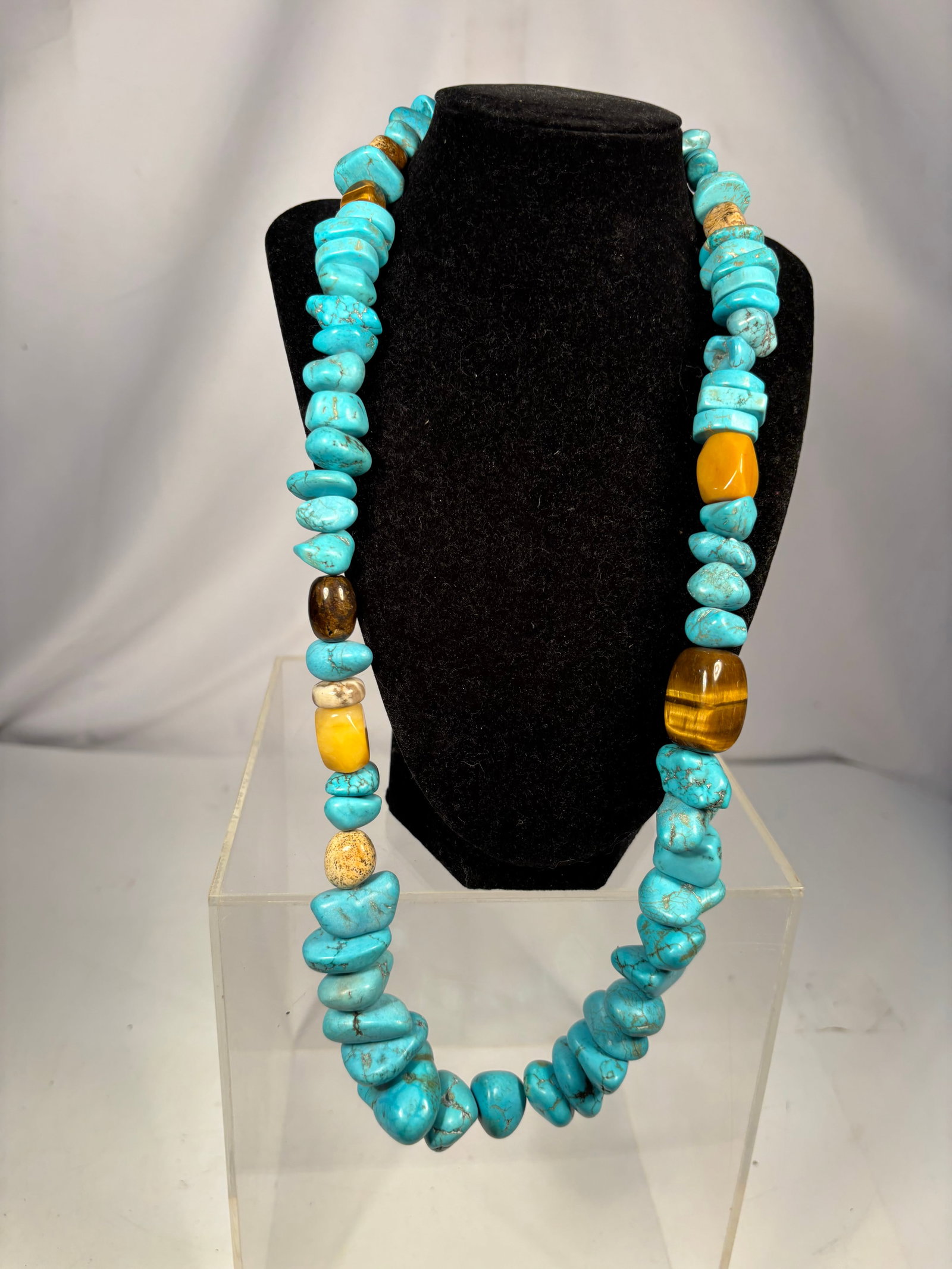 Heavy Turquoise Bead Statement Necklace with Tiger’s Eye & Mixed Stone Accents, 30 In.: Statement necklace featuring turquoise beads accented with tiger’s eye, picture jasper, yellow stone, and disc spacer beads. Measures approximately 30 inches in length and weighs approximately 343 g