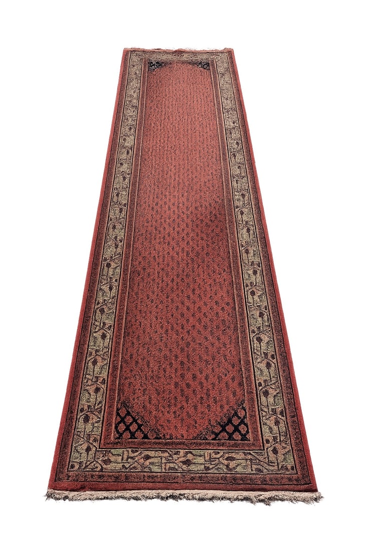 Hand-Knotted Pakistani Bokhara Runner Rug, 10 Ft.: Hand-knotted Pakistani Bokhara-style wool runner featuring an allover repeating gul motif on a rich rust-red field with ivory geometric borders and dark accent spandrels. Traditional elongated hallway