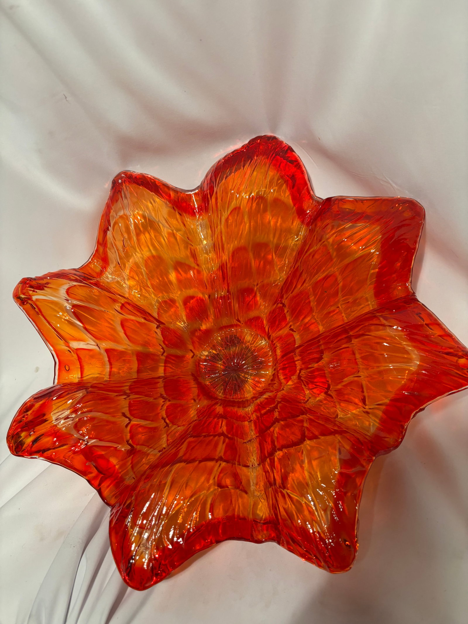 Large Vintage Murano Style Orange Art Glass Flower Form Bowl: Hand-blown art glass bowl formed as an open flower with deeply ruffled petals. Executed in vibrant orange and ruby-red tones with an intricate internal pattern visible throughout the body. The bowl di