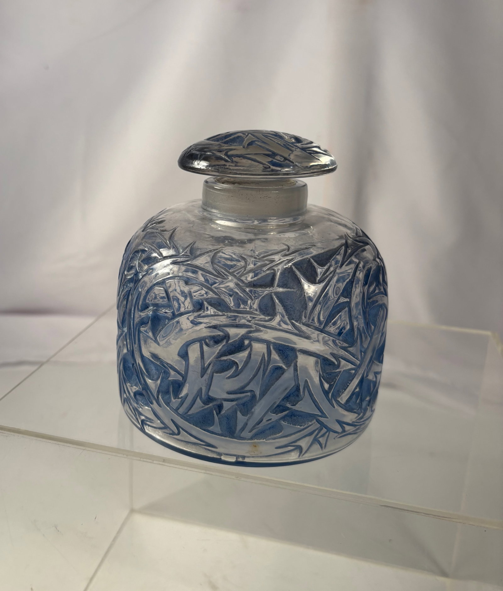 Large René Lalique “Epines?? Frosted Blue Glass Perfume Bottle, France: René Lalique (French, 1860–1945) “Epines” perfume bottle, executed in frosted and clear molded glass with blue patinated decoration. The design features an allover relief pattern of intertw
