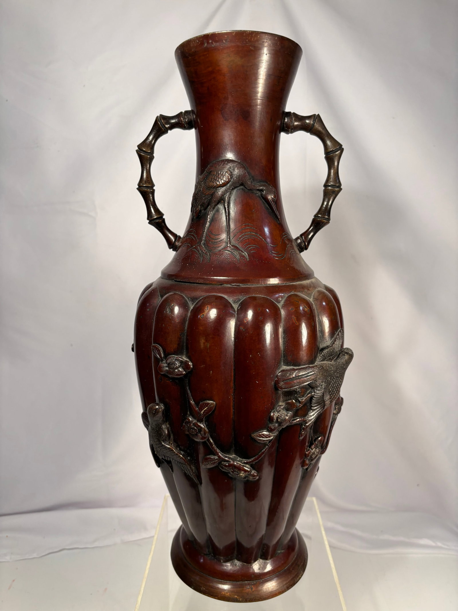 Large Japanese Meiji Period Bronze Double-Handled Vase with Bamboo-Form Handles, Meiji Period (ca.: Japanese Meiji Period bronze double-handled vase of baluster form with bamboo-form handles and a lobed body, finely decorated in high relief with a continuous scene of birds perched among flowering br