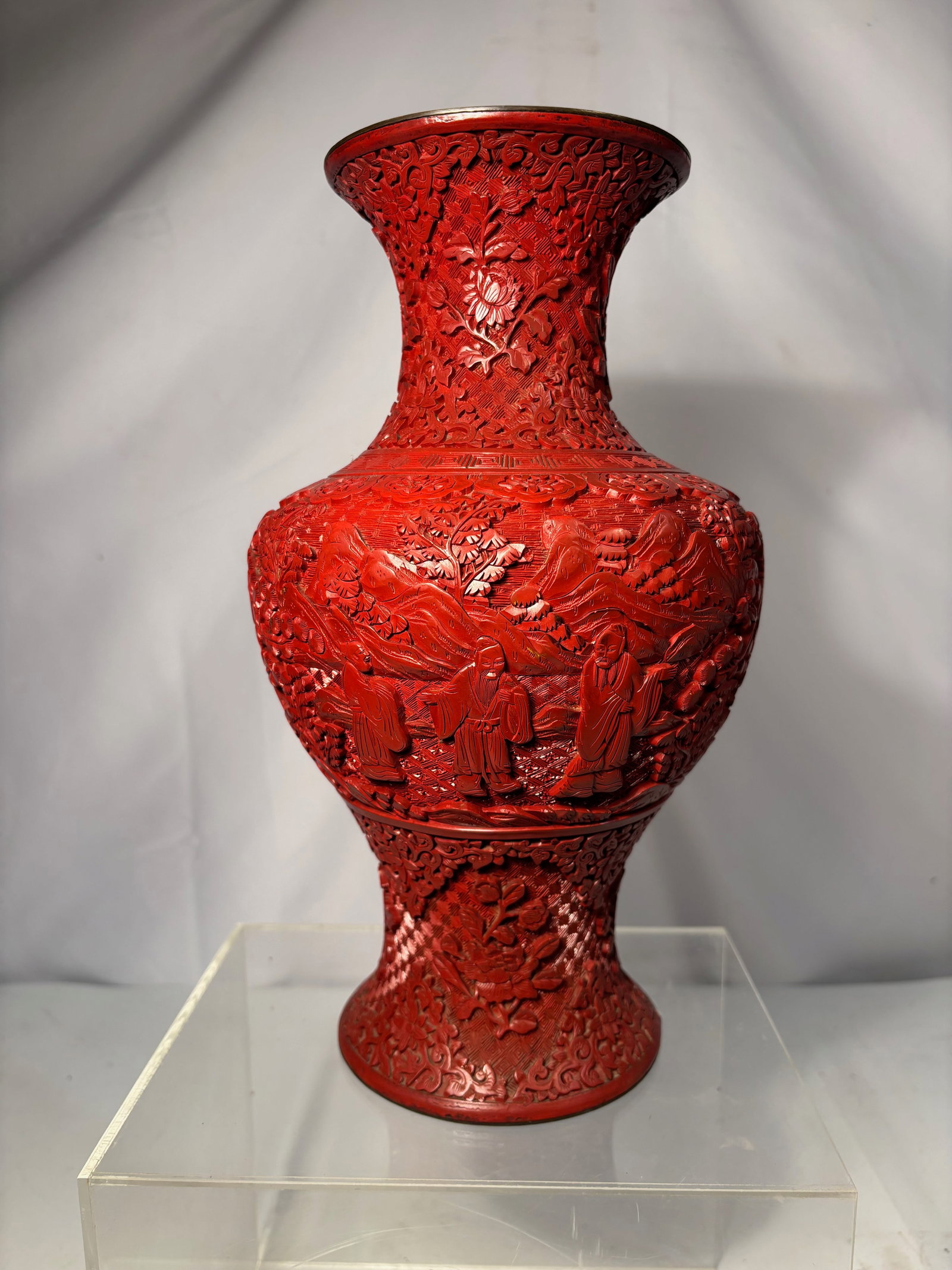 A Chinese Carved Cinnabar Lacquer Vase: Qing Dynasty(1644-1912) ; Large Chinese carved cinnabar lacquer-style baluster vase, finely decorated in high relief with continuous figural and landscape scenes including scholars, attendants, pine t