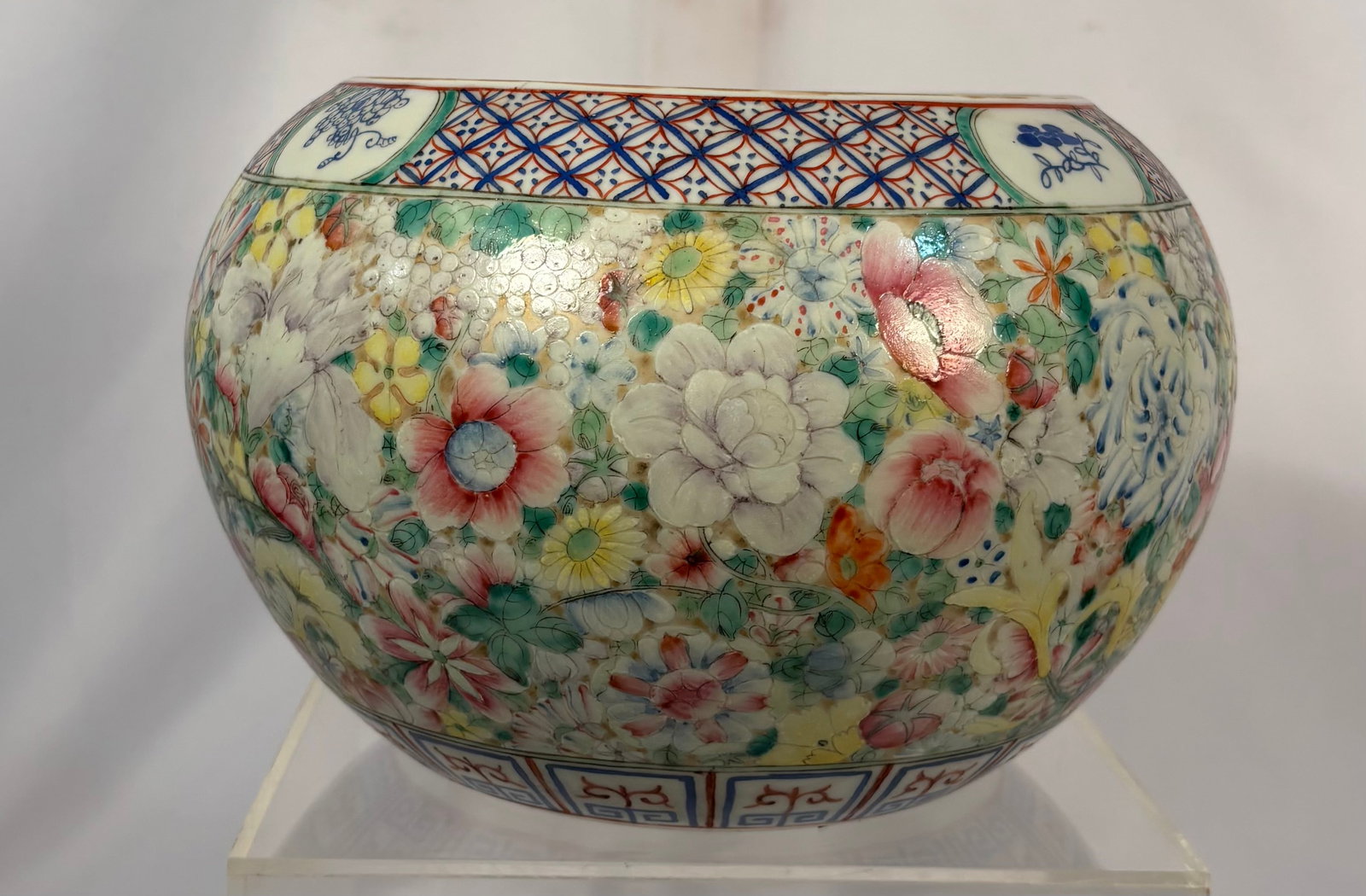 Chinese Famille Rose Millefleurs Porcelain Water Pot, “CHINA?? Mark; Qing Dynasty (1644-1912): A Chinese porcelain water pot of rounded form, densely hand-painted in famille rose enamels with peonies, chrysanthemums and numerous flowering plants in the “Hundred Flowers” pattern. Decorat