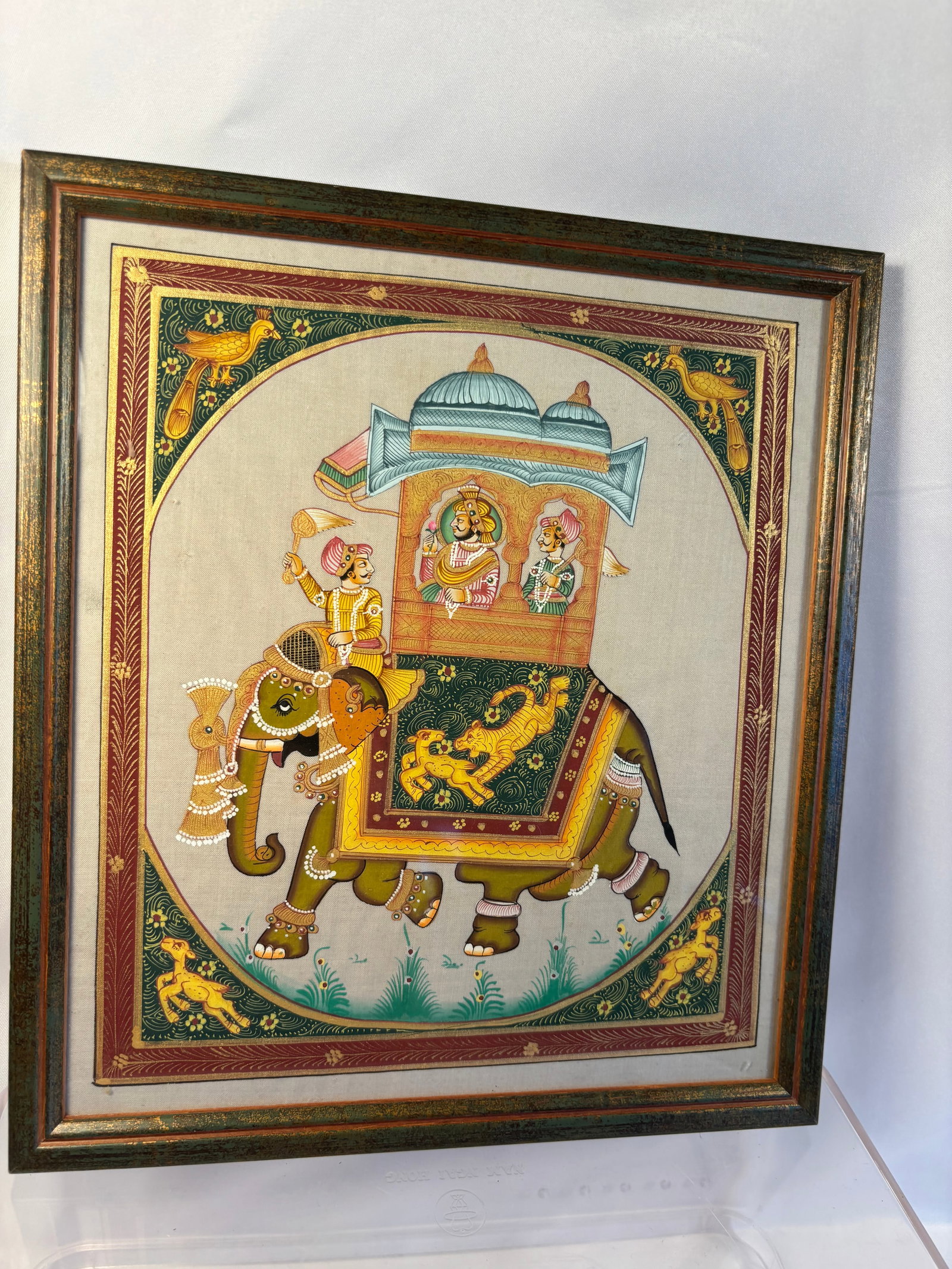 Original Hand-Painted Indian Rajasthani Miniature Silk Painting of Royal Elephant Procession: This exquisite, authentic hand-painted Indian miniature artwork , showcasing a regal Rajasthani Ambabari procession where a Maharaja and his consort ride within a grandly detailed, domed palanquin ato