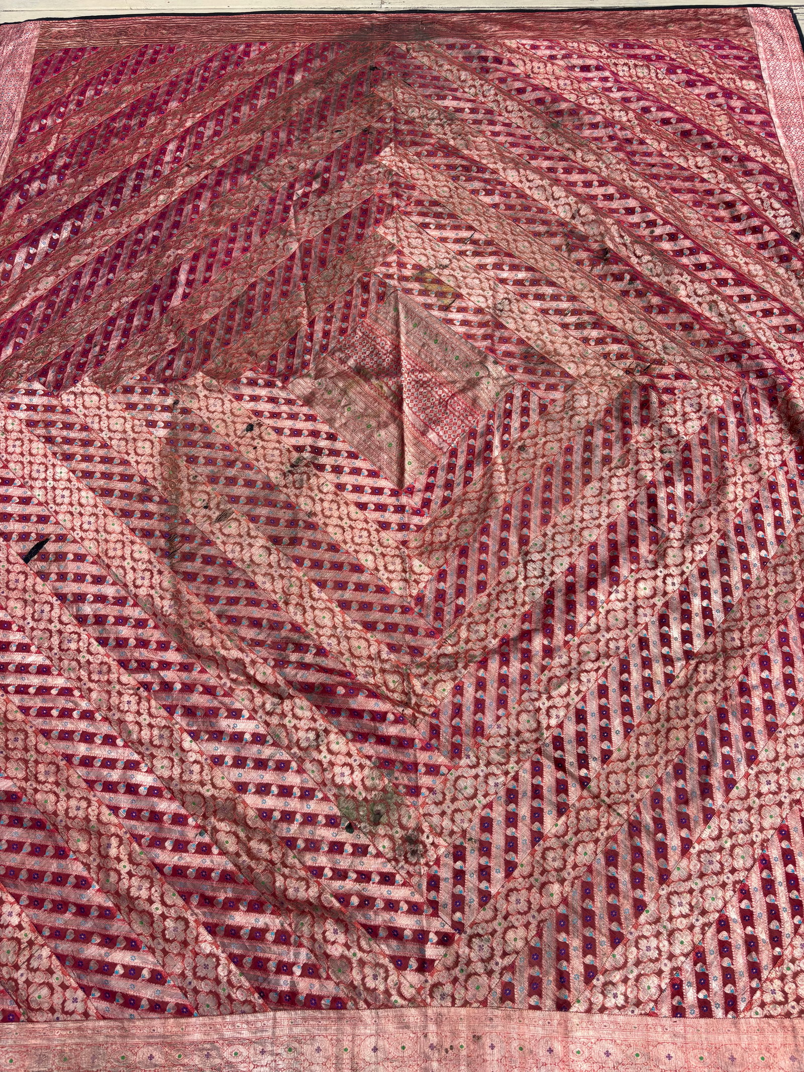 Antique Indian Banarasi Brocade Silk Gharchola-Style Patchwork Textile 102 X 88 in.: An exquisite handcrafted Indian patchwork textile assembled from upcycled vintage South Asian saree fabrics. The textile features high-quality Banarasi brocade silk richly woven with shimmering gold- 