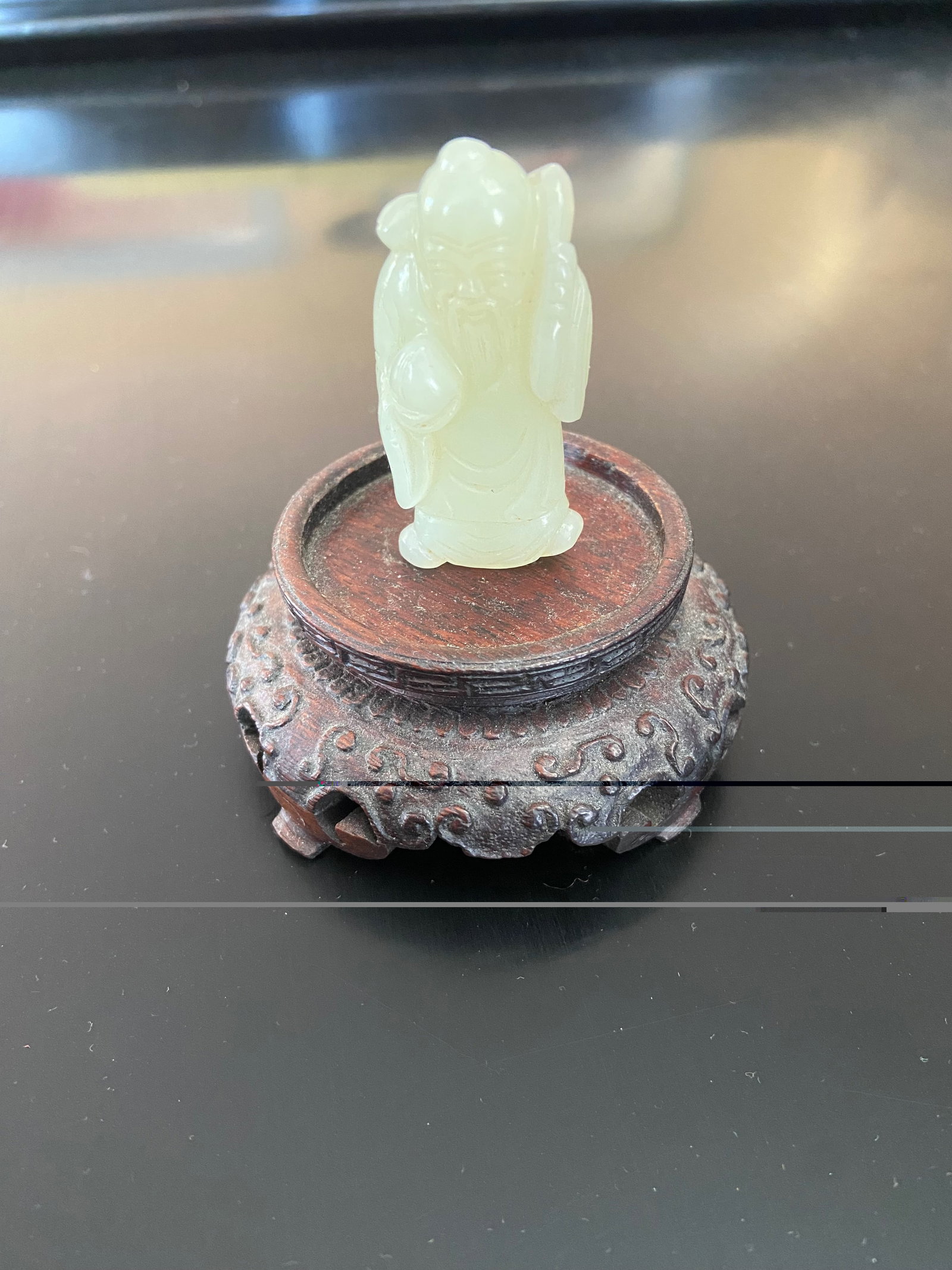 A Chinese nephrite jade old man statue: Qing Dynasty (1644-1912); Dimensions?Height: 2 inches