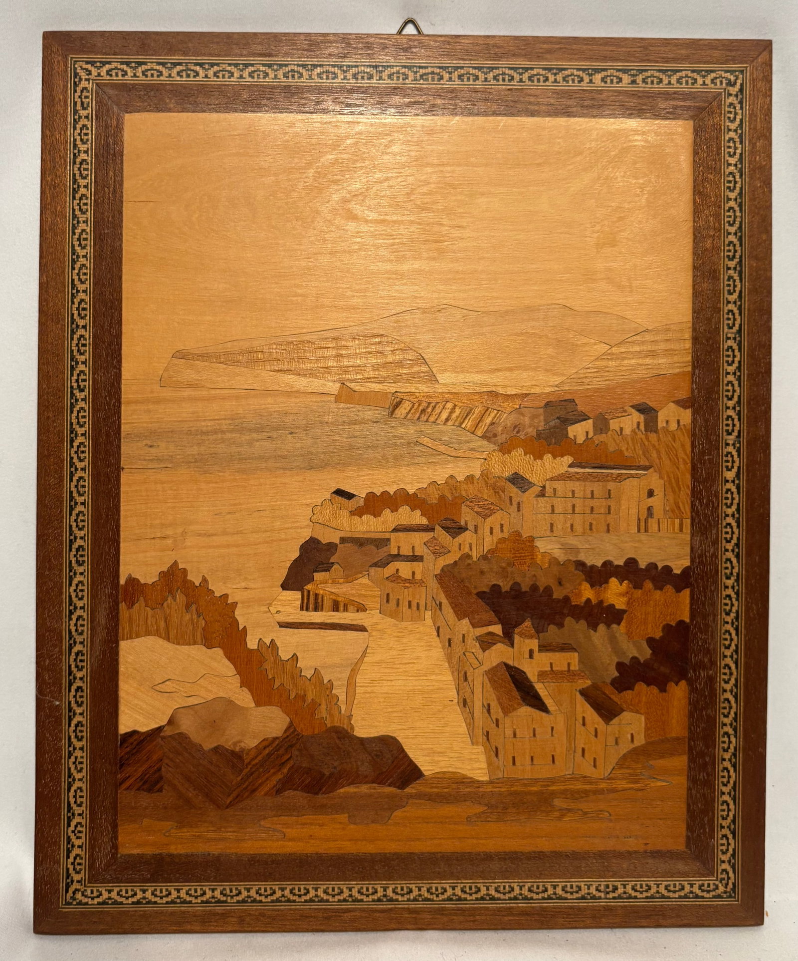 Vintage Italian Sorrento Marquetry Wood Inlay Coastal Village Scene: Vintage Italian marquetry (intarsia) wood inlay panel depicting a picturesque coastal village overlooking the Mediterranean Sea. Handcrafted from carefully selected natural wood veneers of varying ton