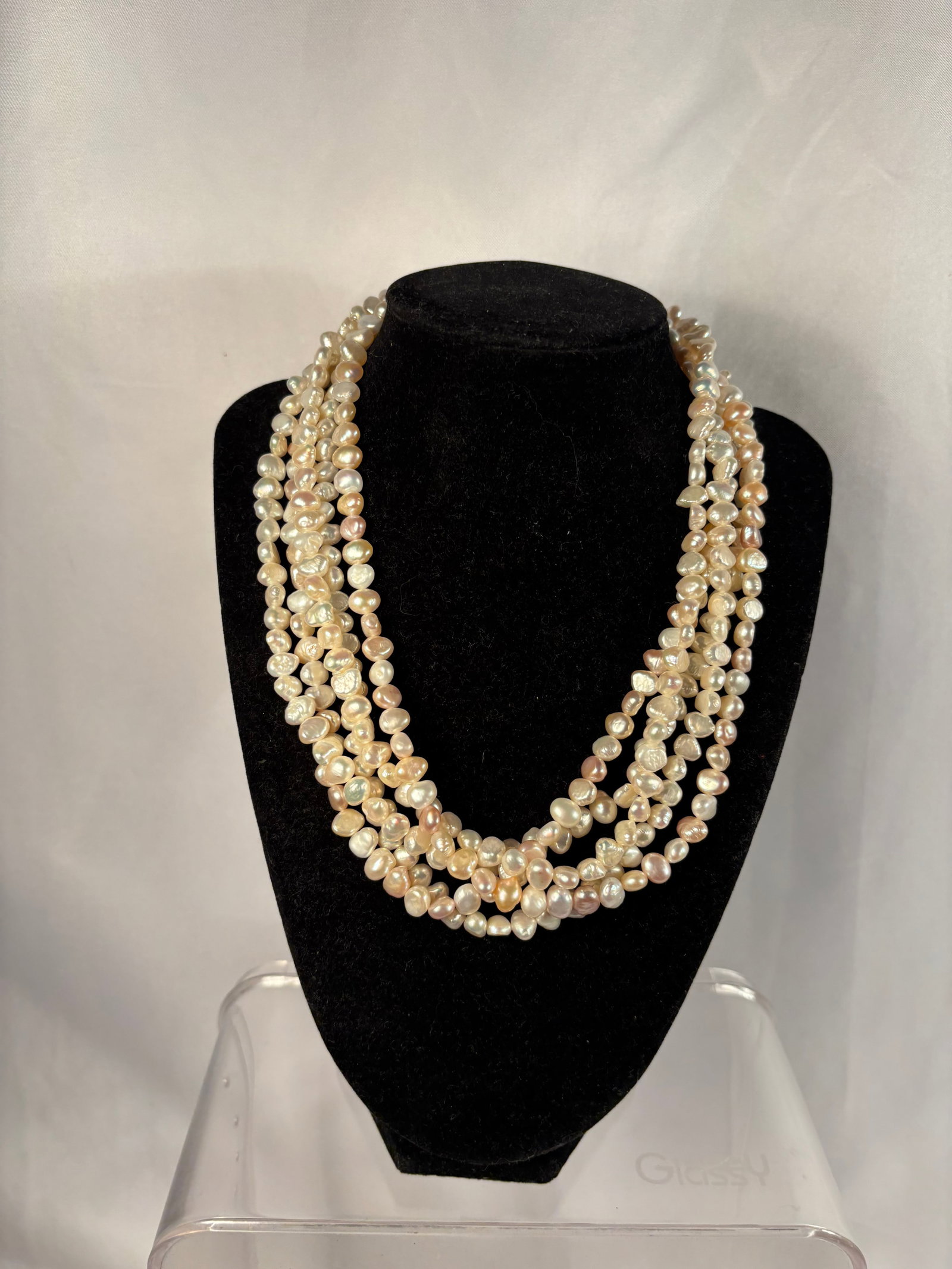 Six-Strand Baroque Freshwater Pearl Necklace with Pearl-Set Clasp: An elegant six-strand necklace composed of irregular baroque freshwater cultured pearls displaying cream, champagne, pale pink, and peach tones with attractive iridescent luster. Completed with an ova