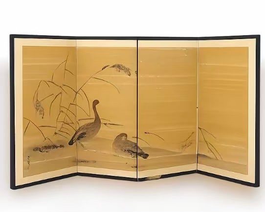A Japanese Four-Panel Folding Screen with Geese and Reeds, Signed: Japanese four-panel folding screen featuring a pair of geese amid reeds on a gold ground. Ink and color on paper with artist’s signature and seal. The reverse decorated with repeating geometric moti