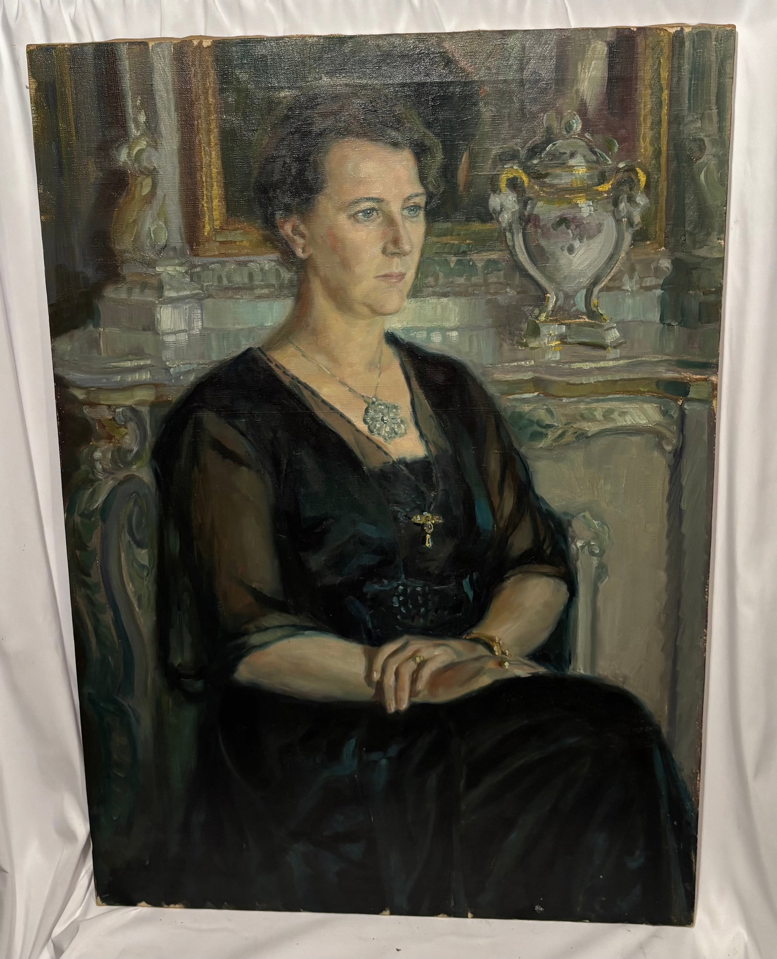 Andreas Eik ? (Swedish, Early 20th Century) . Portrait of a Lady, 1921 Oil on Canvas: A finely executed Swedish portrait depicting an elegant seated lady dressed in black, rendered in a sophisticated early 20th-century academic style. The sitter is shown before an ornate interior setti