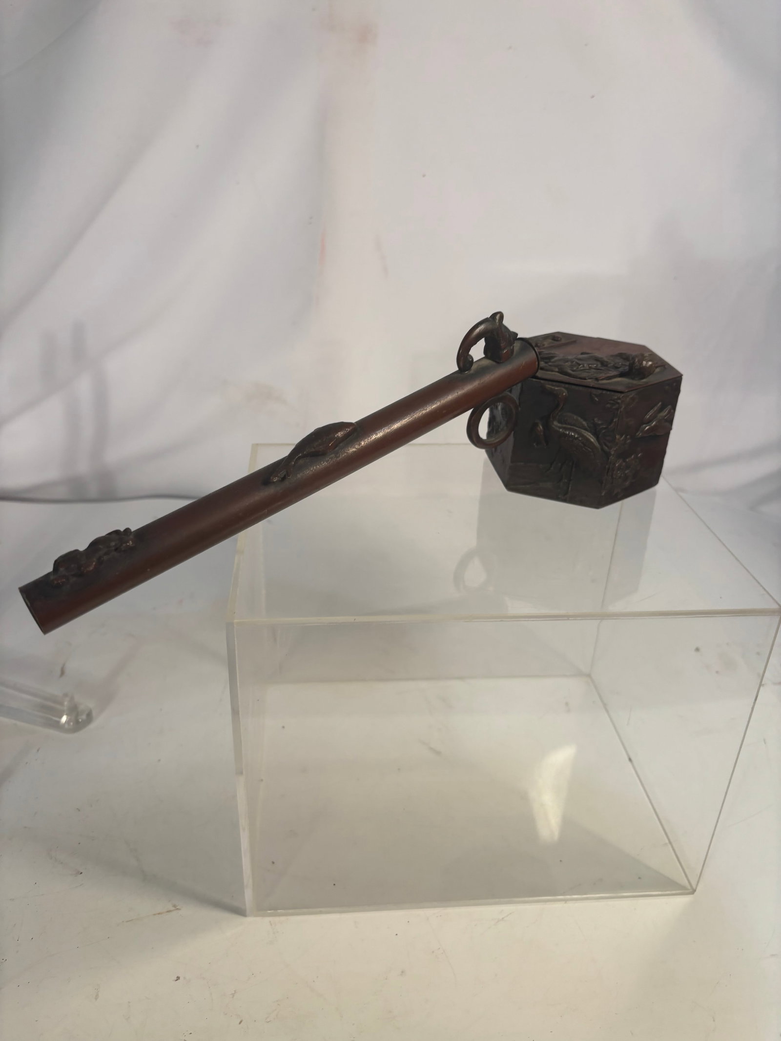Antique Japanese Meiji Bronze and Copper Yatate Calligraphy Brush Holder and Inkwell, Meiji Period: An antique Japanese portable writing set known as a yatate, comprising a long cylindrical copper brush holder attached to a hinged bronze inkwell. Decorated in relief with cranes, flowering prunus bra