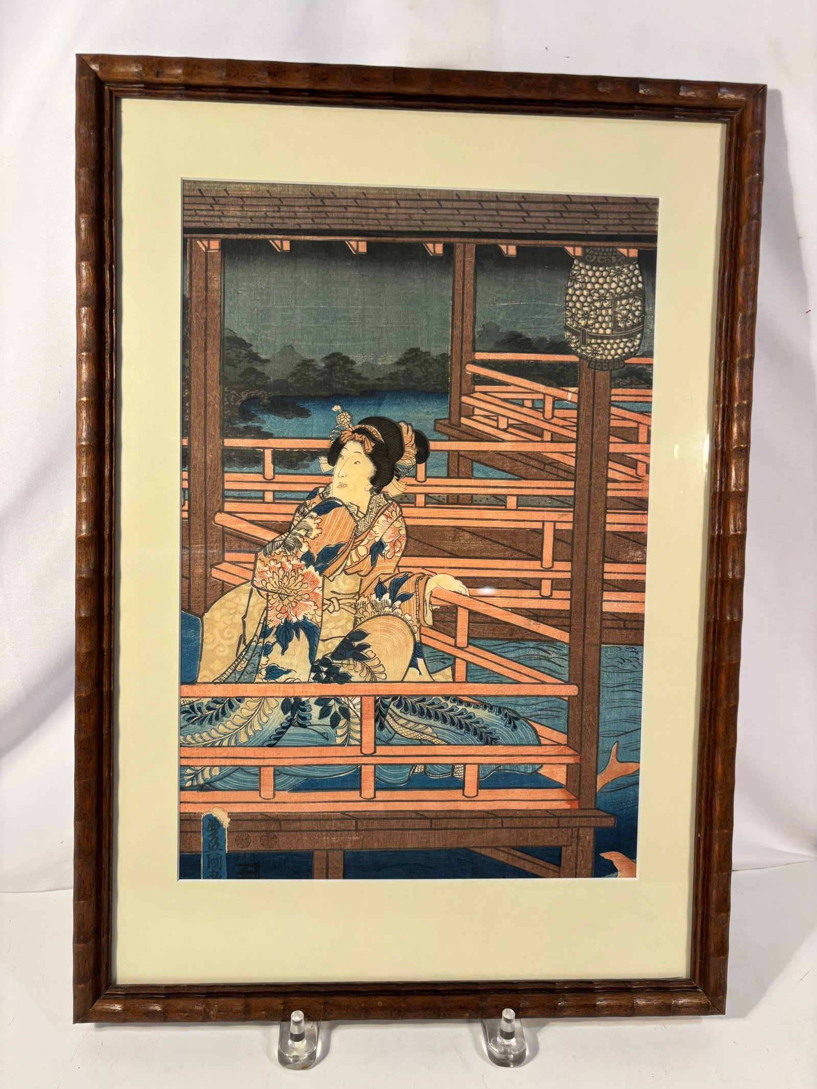 Utagawa Hiroshige & Kunisada, Moonlight View of Tsukuda, 1853 Ukiyo-e Woodblock Print: An Edo-period Japanese color woodblock print by Utagawa Hiroshige (1797–1858) and Utagawa Kunisada, also known as Toyokuni III (1786–1865). Titled Moonlight View of Tsukuda with Lady on a Balcony,