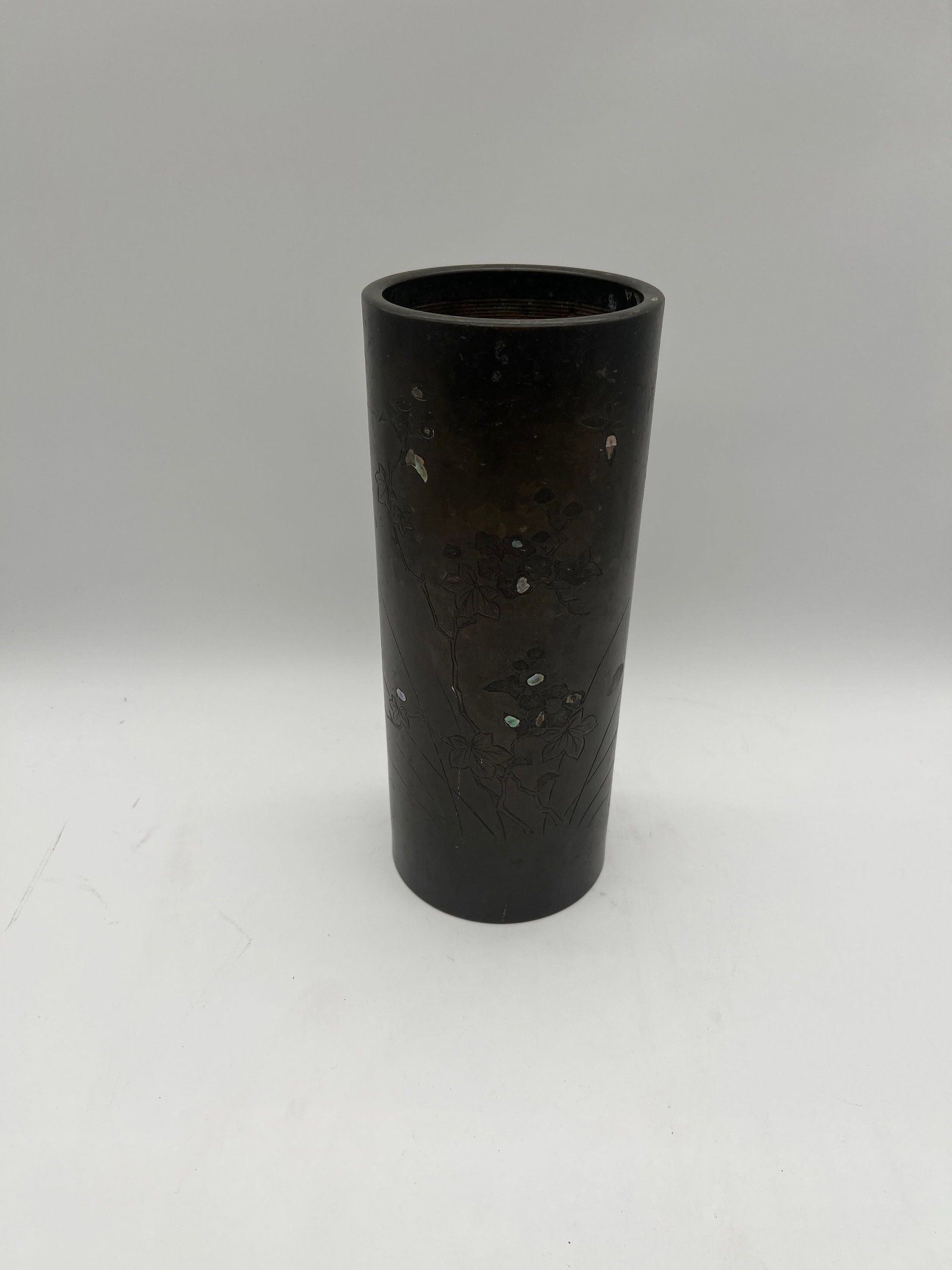 A Chinese Bronze hat vase with mother-of-pearl inlaid: Qing dynasty (1644-1912); The vase or cylindrical container made from bronze with floral carvings and mother-of-pearl inlaid. Dimensions?Height: 11.5 inches