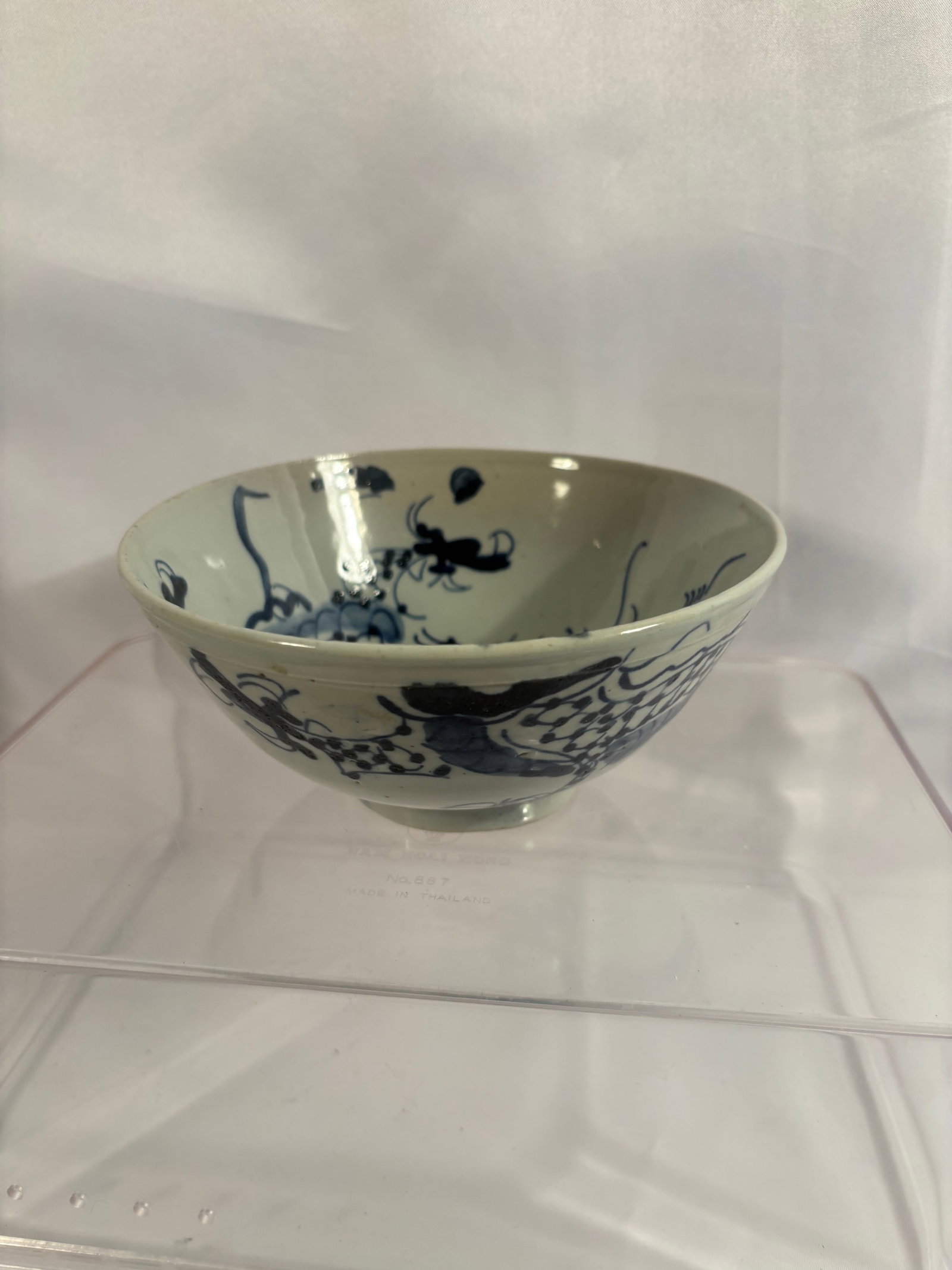 Chinese Blue and White Porcelain Dragon Bowl with Mark, Ming Dynasty( 1368- 1644 ): A Chinese blue and white porcelain bowl, Ming Dynasty, of deep rounded form raised on a short circular foot. The interior is boldly painted in underglaze cobalt blue with a vigorous coiled dragon surr