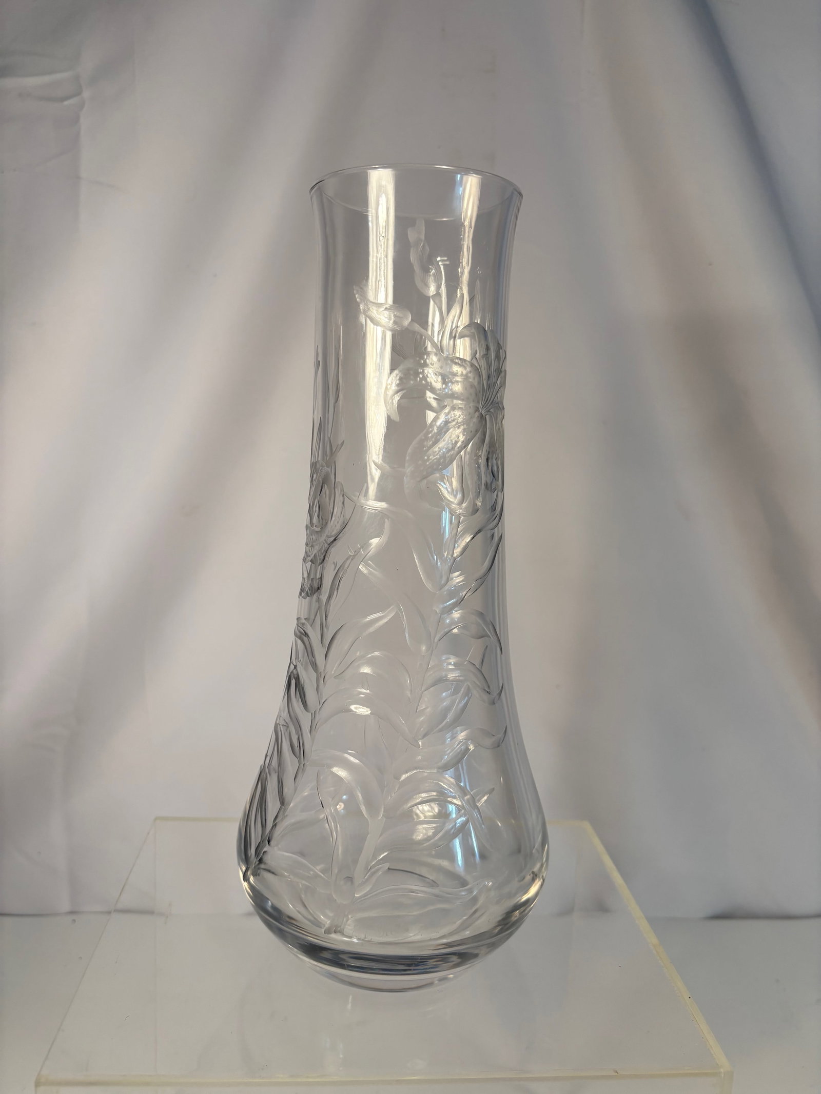 A Fine Marked Maw & Keg Hand-Engraved Crystal Vase, England, circa 1950s: A fine hand-engraved crystal vase by Maw & Keg, England, mid-20th century, marked MAWKEG to the base. The tall cylindrical body finely wheel-engraved with large stylized lilies and scrolling leaves, t