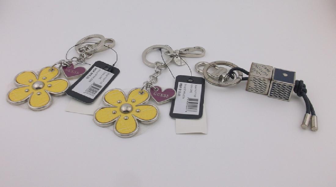 Louis Vuitton & Guess Keychain Lot: both guess keychains are new with tags, Louis Vuitton shows wear