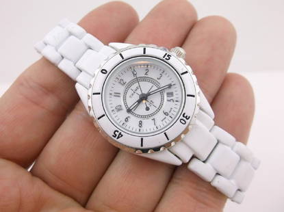 New Chanel J12 White Ceramic Wristwatch Authentic: A stunning New without Box Authentic Chanel Womens White Ceramic J 12 Wristwatch serial #ZG 58096. Watch runs perfectly and has new battery, crystal is in perfect condition with no scratches, band,