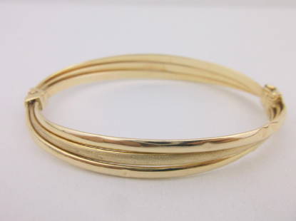 Heavy 14kt Gold Triple Row Lock Bracelet: A Solid 14kt Gold Italian Triple Row Lock Bangle Bracelet that is hinged. This Bracelet is thick and heavy, it has several dings as shown on both sides, Im not sure if the dings can be repaired or not