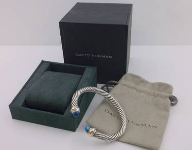 Incredible David Yurman Sterling 14k Topaz Bracelet: An Incredible Authentic David Yurman In Box Sterling Silver and 14kt Gold Genuine Blue Topaz Bracelet. Comes in Box with bag, this is the BIG 7mm version, they heavy one! In superb excellent condition