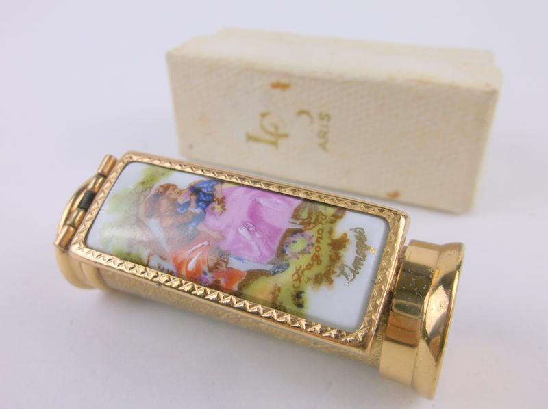Incredible Antique LCS Paris France Limoges Lipstick: An incredible Antique LCS Paris France Flip Mirrored Lipstick Case in original box and never used. The front is adorned with a hand painted Limoges France porcelain plaquette. In antique new old stock