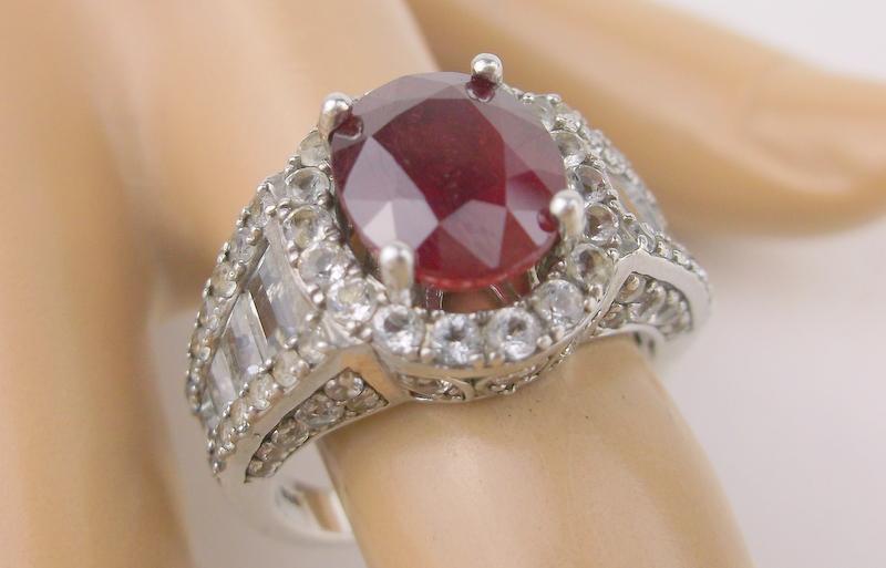 Stunning Sterling Silver 6ct Ruby Ring 8.5 White Topaz: A Stunning Sterling Silver Genuine 6ct Ruby Solitaire Ring with white topaz adorning the sides in excellent condition size 8.5