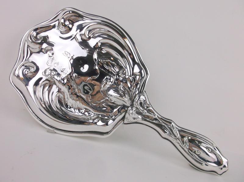 Incredible 1905 Sterling Silver Lady Butterfly Mirror: Antique original Dated 1905 Large Heavy Gorgeous Sterling Silver Hand Mirror Adorned with A Lady holding out her hand with a butterfly on her finger, ivy and flowers flow up the handle and around side