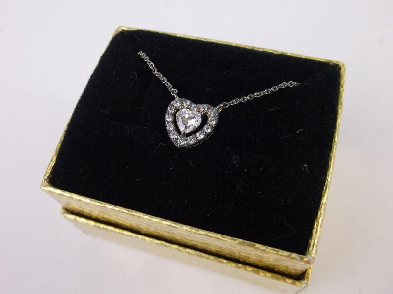 New Boxed Sterling Valentines Heart Necklace 18": A Brand New Solid Sterling Silver item in original box in New Condition. Guaranteed Solid Sterling Silver and ready for gifting or resale.