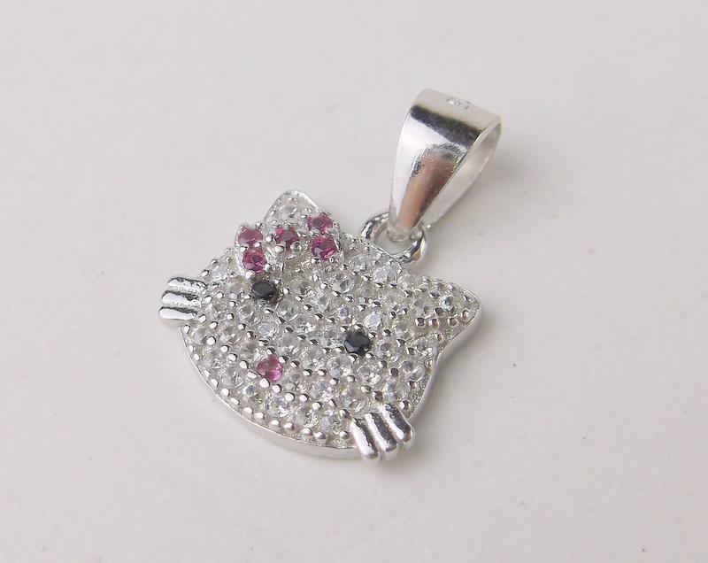 New Sterling Silver Hello Kitty Pendant: Solid Sterling Silver Guaranteed, in Brand New Never Worn Condition.