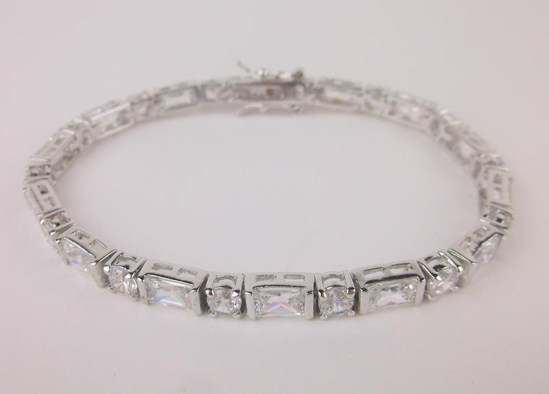 New Heavy Sterling Silver Tennis Bracelet 7": Solid Sterling Silver Guaranteed, in Brand New Never Worn Condition.