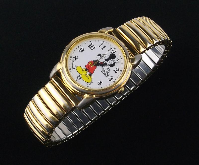 Vintage Disney Lorus Mickey Mouse Wristwatch: A Vintage Disney Lorus Mickey Mouse Wristwatch in perfect working condition with new battery. Band Has Fading, and Face (Crystal) has scratches.
