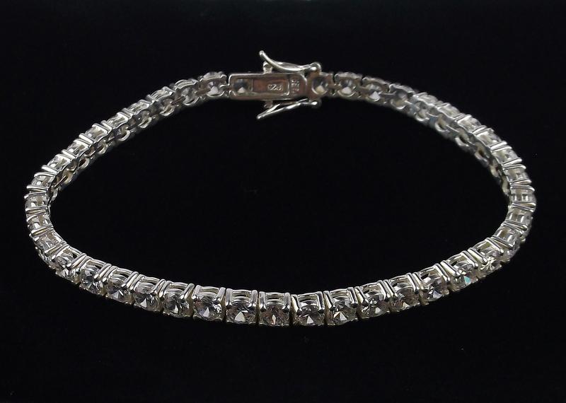 New Sterling Silver Tennis Bracelet 7.5 Inch: Solid Sterling Silver Guaranteed, in Brand New Never Worn Condition.