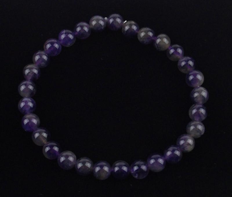 New Healing Genuine Amethyst Bracelet 6mm: A Healing genuine gemstone bracelet, stretches to fit, in brand new never worn condition.