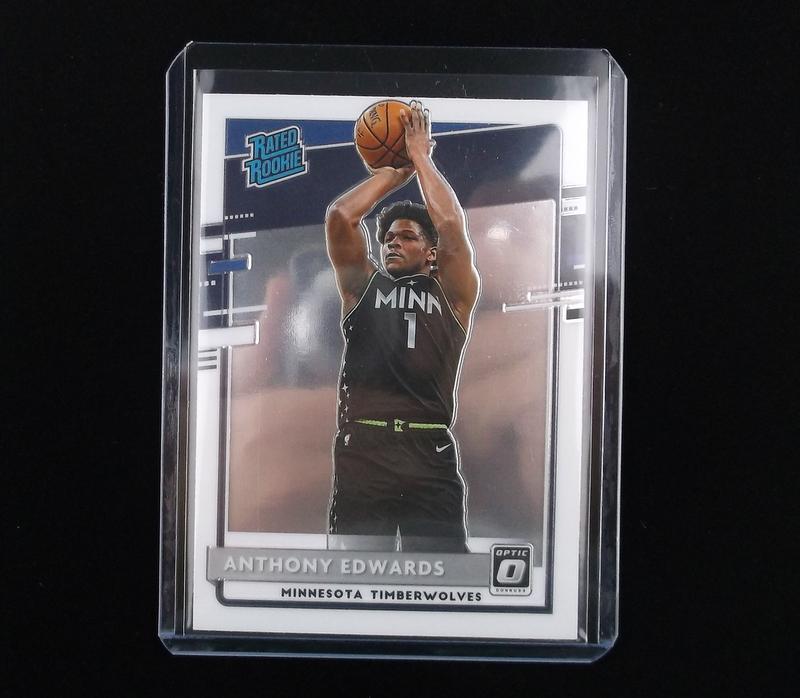 2020 Panini Optic Anthony Edwards Rated RC Card Minty: q All trading card singles are straight from pack to penny sleeve and top loader/card saver and are in great condition.