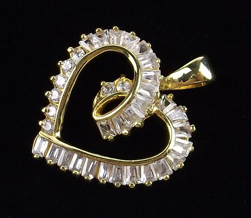 New Gold Over Sterling Silver Heart Pendant: Solid Sterling Silver Guaranteed, in Brand New Never Worn Condition.