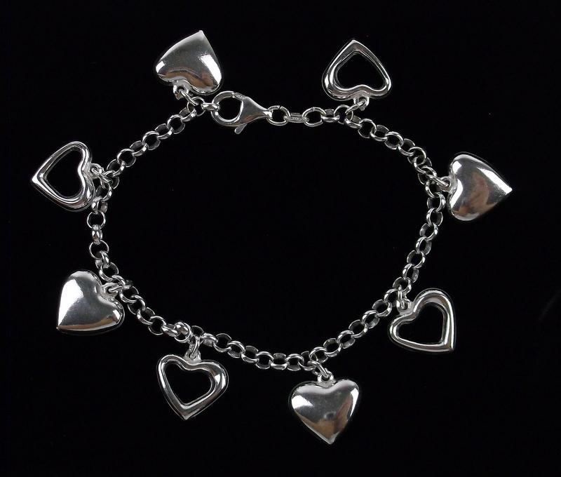 New Sterling Silver Heart Charm Bracelet 7.5": Solid Sterling Silver Guaranteed, in Brand New Never Worn Condition.