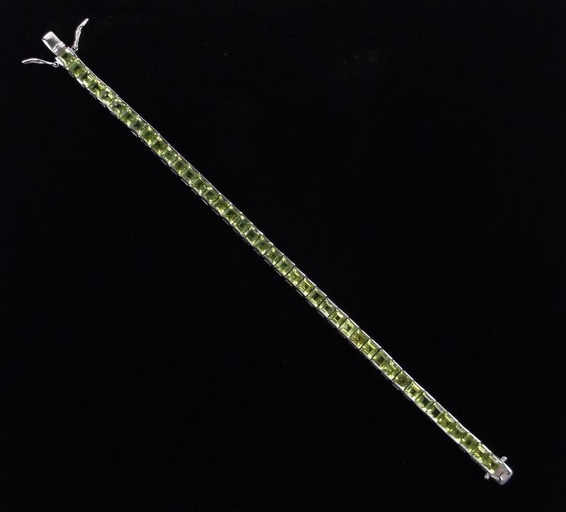 New Heavy Sterling Silver Peridot Tennis Bracelet 7.25": Solid Sterling Silver Guaranteed, in Brand New Never Worn Condition.