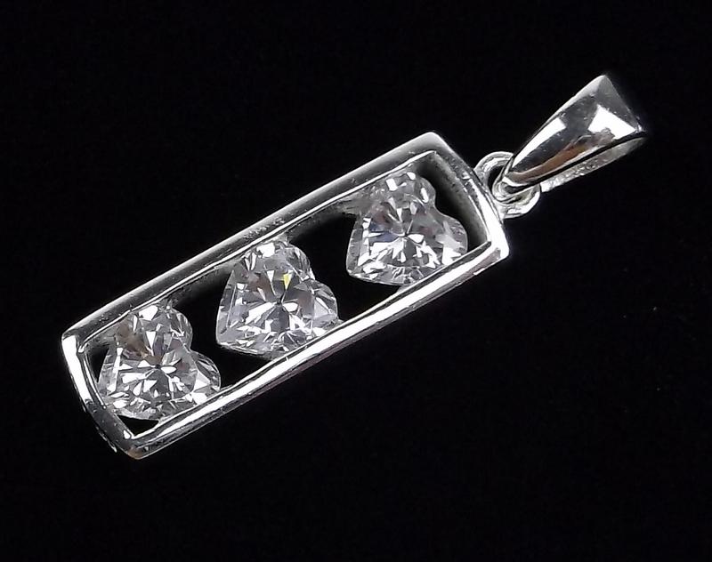 New Sterling Silver Heart Pendant: Solid Sterling Silver Guaranteed, in Brand New Never Worn Condition.