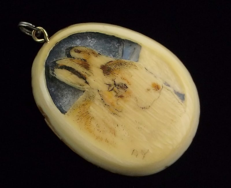 Vint 1910s Carved Rabbit Walrus Scrimshaw Pendant Signed: A Stunning Vintage 1910s Carved Walrus Scrimshaw of a Rabbit/Hare, signed as shown and all original. This is a very old pendant and very well carved. In very nice condition