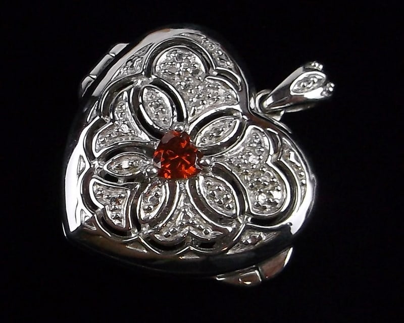 New Thick Sterling Silver Garnet Heart Locket Pendant: Solid Sterling Silver Guaranteed, in Brand New Never Worn Condition.
